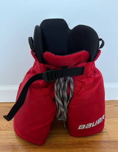 Red Bauer hockey pants