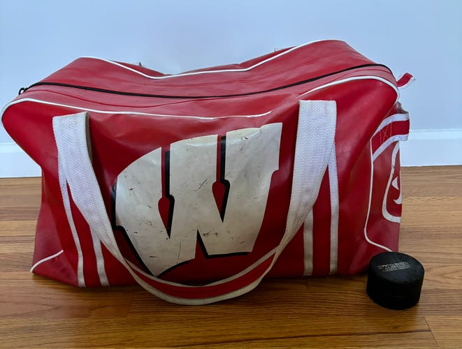 Red hockey bag (comes With Two Pucks)