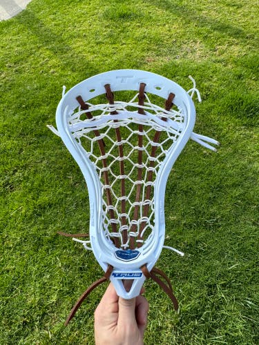 True frequency lacrosse head traditionally strung