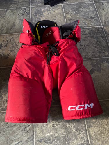 Red CCM Tacks hockey pants