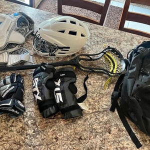 Lax gear includes stick, helmet, bag, cleats and padding.