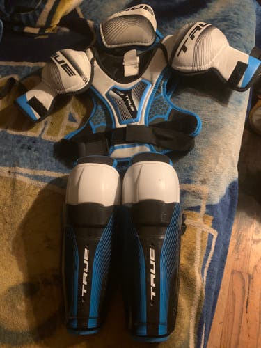 Used Large Junior True Shoulder Pads , Shin Guards And One Elbow