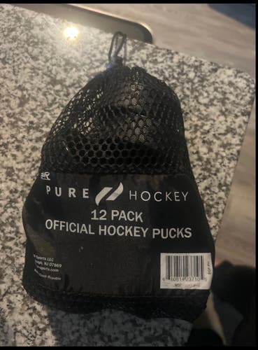12 New Pure Hockey Pucks