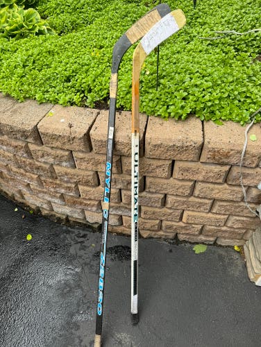 2 Wooden Hockey Sticks
