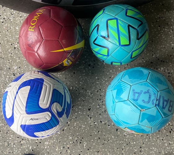 4 barely used soccer balls