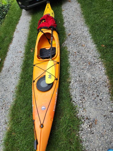 Kayak, Paddle & Spray Skirt manufactured by Wilderness Systems.