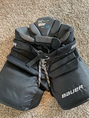 Used Bauer Elite Hockey Goalie Pans, size: Intermediate/ Medium.