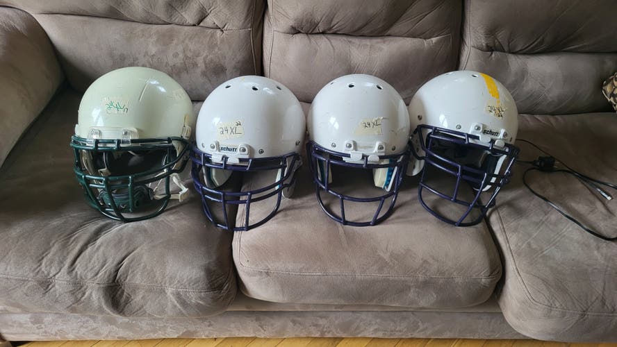1 bundle of 4 Used XL Adult  Helmets