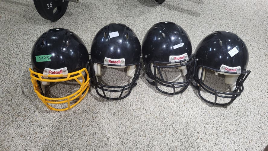 1 bundle of 4 Used Medium Adult Riddell Helmets
