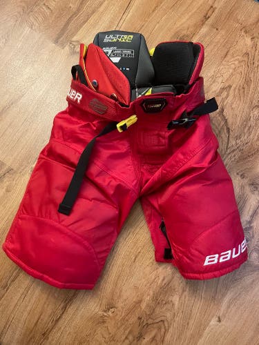 Bauer ultrasonic red hockey pants, junior large