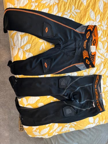 PRICE REDUCED (2) NEW Youth hockey pants with Velcro