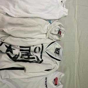 4-Used Hockey Jerseys -White Youth