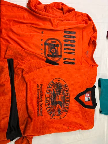 2-Used Hockey Jerseys -Orange Adult