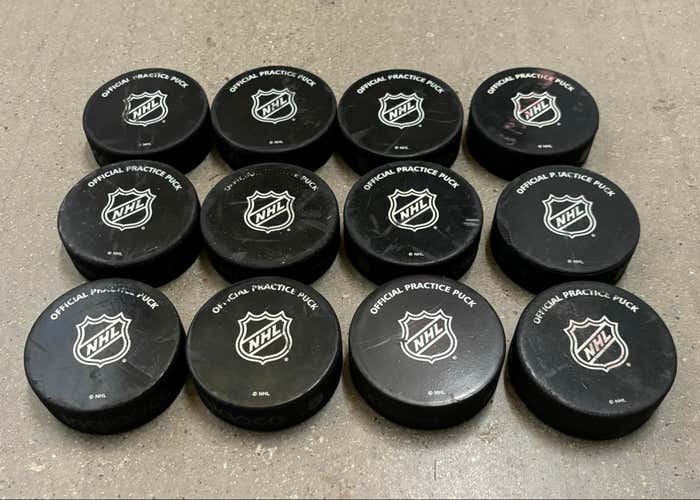 Lot of 12 NHL Hockey Practice Pucks