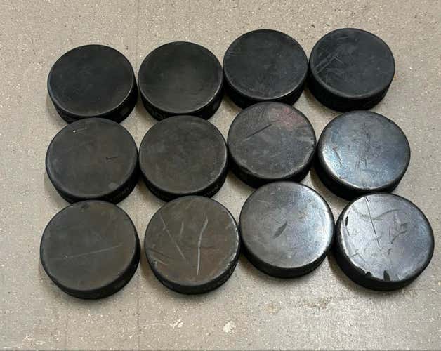 Lot of 12 Blank NHL Hockey Pucks