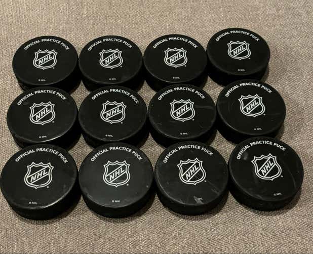 Lot of 12 NHL Official Practice Hockey Pucks