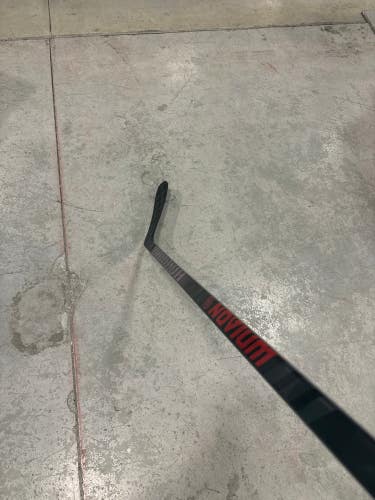 Used Intermediate Warrior Novium Pro Hockey Stick Right Handed W03 63 Flex