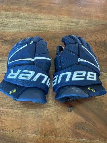 Used Bauer navy blue Hyperlite gloves 14"