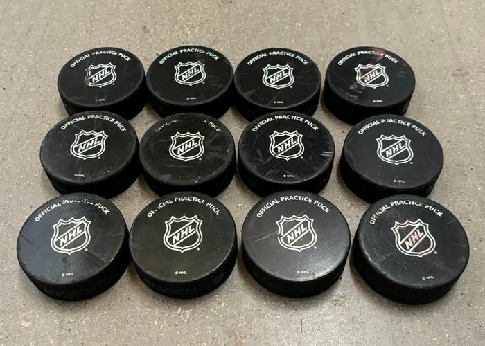 12 NHL Official Hockey Practice Pucks Slightly Used