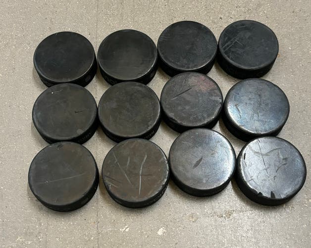 12 NHL Blank Hockey Pucks Slightly Used