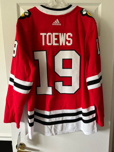 NWT Jonathan Toews Chicago Blackhawks Red New Size 54 Men's Adidas Authentic Jersey