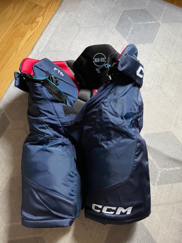 Used Navy Senior Medium CCM Jetspeed FT6 Pro Hockey Pants