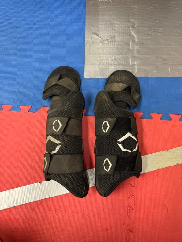 Two Black Used Senior EvoShield Leg guards  - 1 RHH 1 LHH