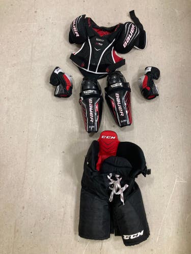 Used Junior Bauer/CCM Starter Kit (Shoulder Pads, Pants, Shin Pads, Elbow Pads)