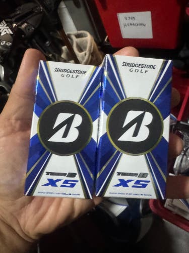 Bridgestone tour golf balls 2 sleeves of 2 balls .