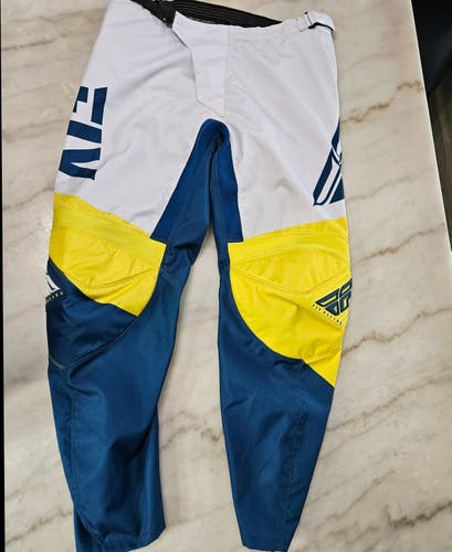 Used Fly Racing F-16 MX Pants, Yellow/ Blue Color, Size 38