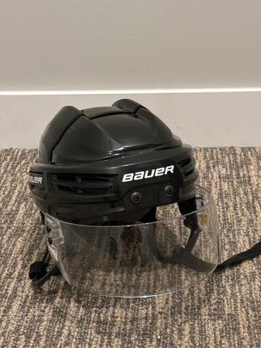 Used Bauer IMS helmet with visor, size Medium