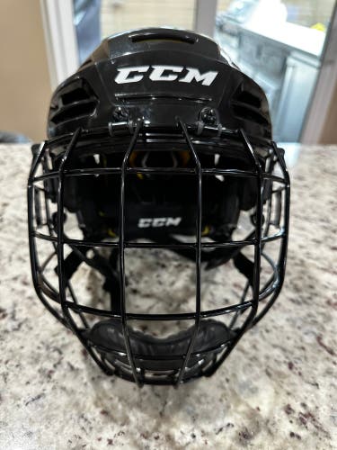 Used CCM Tacks 310 medium helmet combo