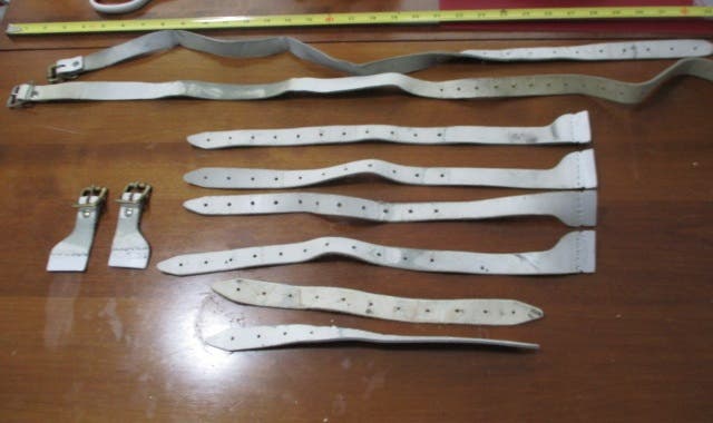 Used White and Red Goalie Pad Straps and Buckles