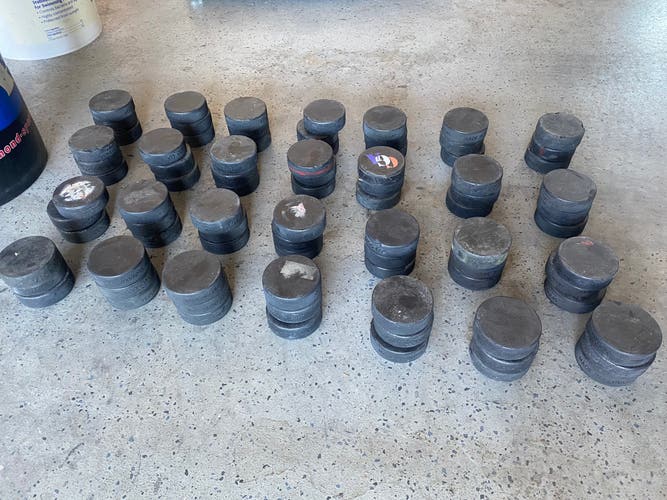 80 Used Hockey Pucks