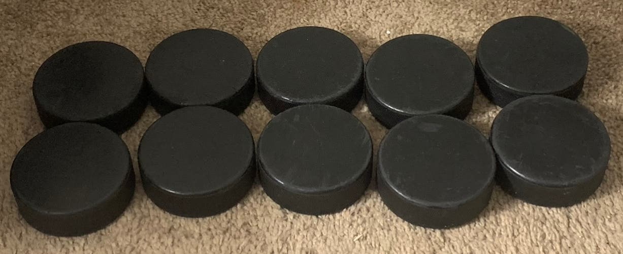 10 Used Hockey Pucks