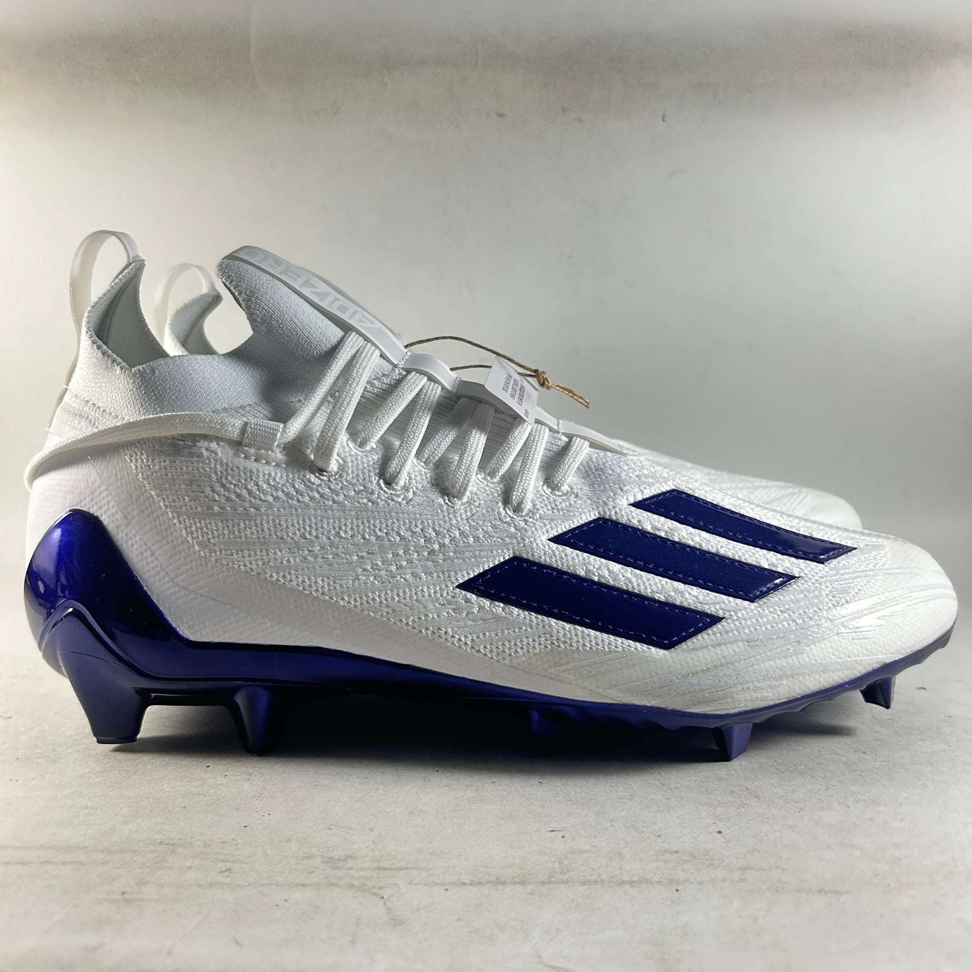 purple and white adidas cleats