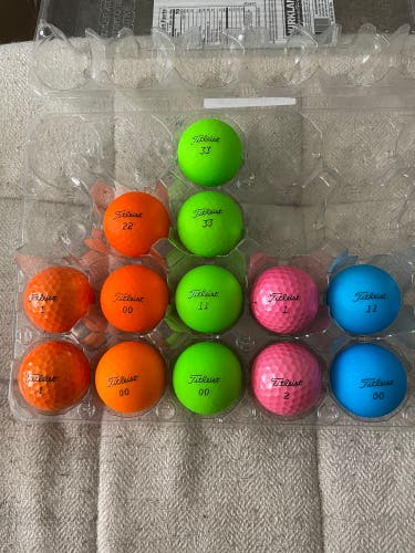 13 Titleist Velocity Golf Balls - Various Colors (Orange, Green, Blue, Pink)