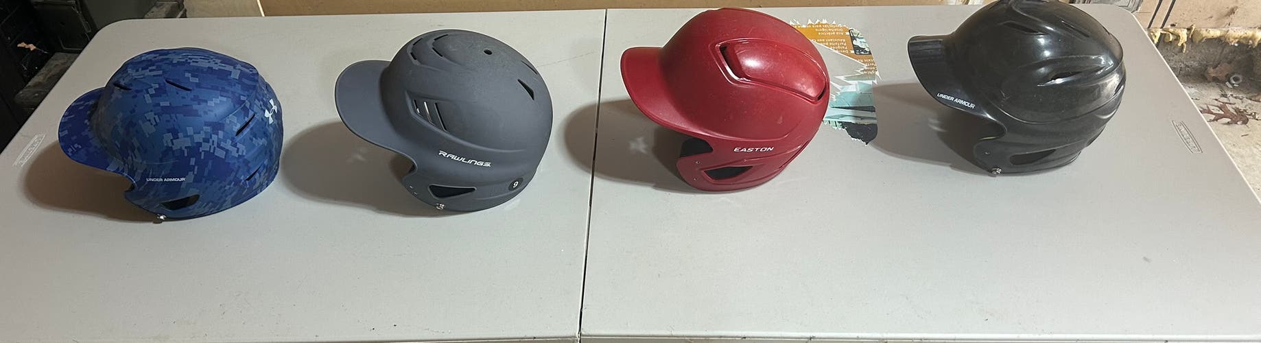 Four Used One Size Fits All  Batting Helmets