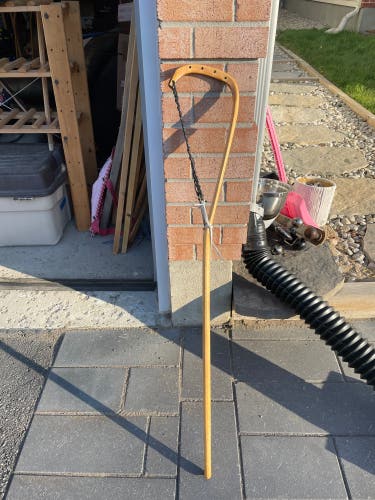 Mowhawk wooden traditional lacrosse stick with nylon gutwall