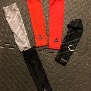 Lot of sports arm sleeves, youth large and youth small