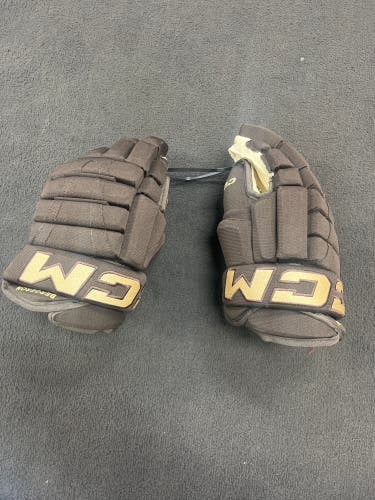 Patrice Bergeron Pro Stock CCM HG96 14” Four roll gloves. Winter classic brown gold