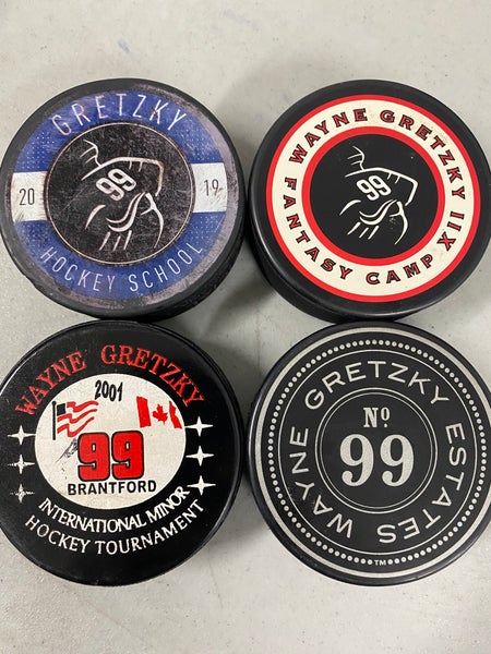 Four Gretzky pucks