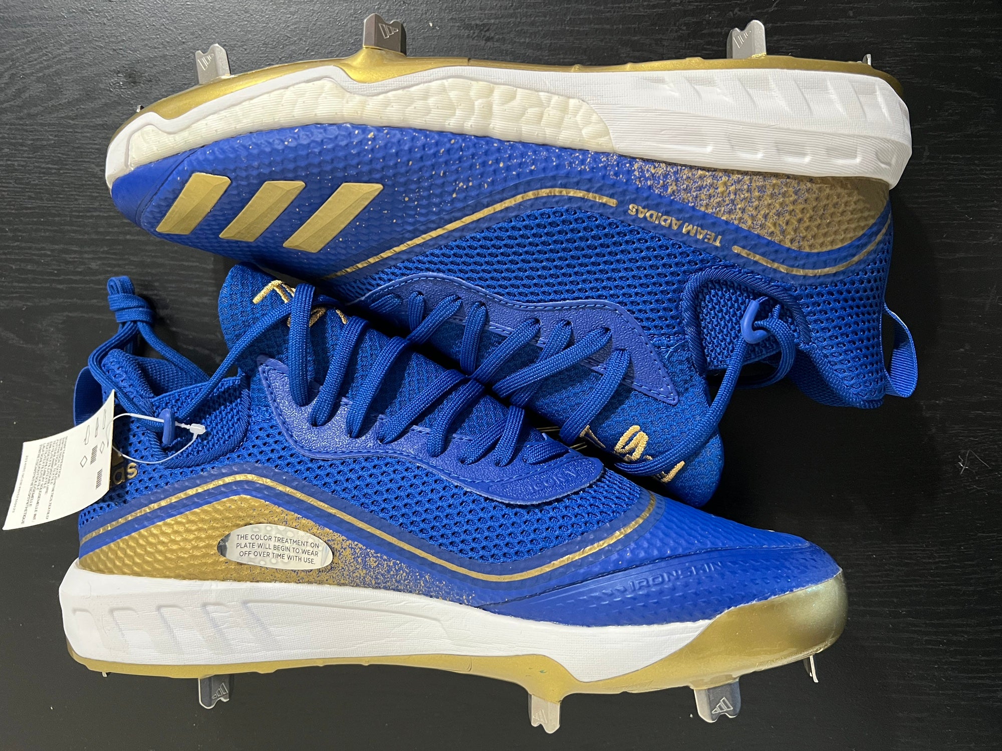 navy blue and gold soccer cleats