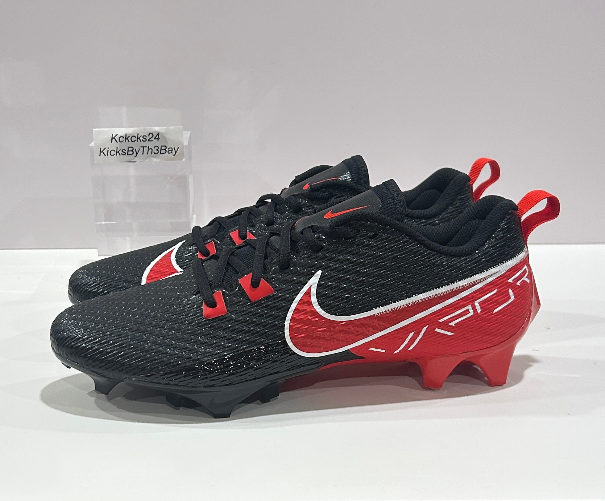 red and black football cleats mens