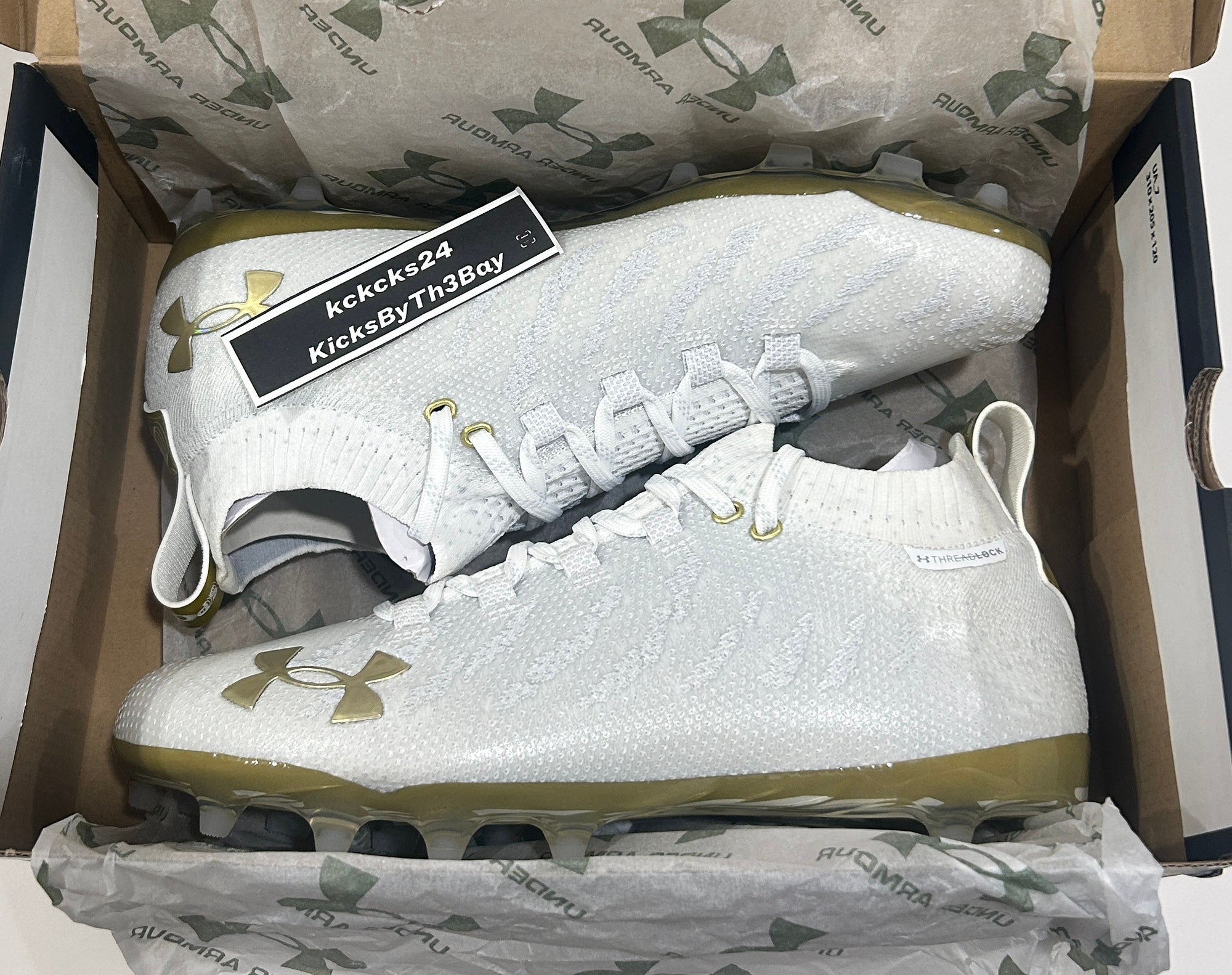 white and gold under armour cleats