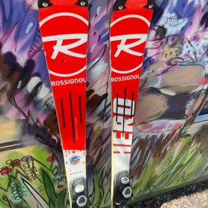 Used 137cm Rossignol Racing Hero Jr Multi Event Skis w/ Look NX7 system binding.