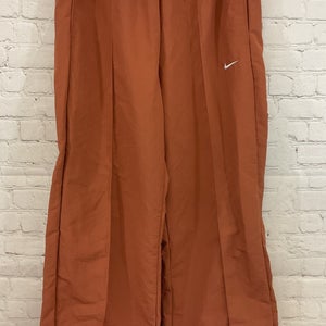 Nike FQ3588-825 Women's REPEL Standard Fit Mid Rise Nylon Pants Orange M Medium