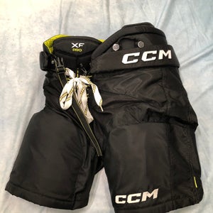 Black Junior Medium CCM Tacks XF Pro Hockey Pants (Used)