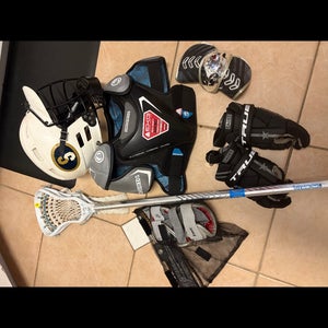 Youth medium lacrosse equipment set up . Meets NOCSAE standards