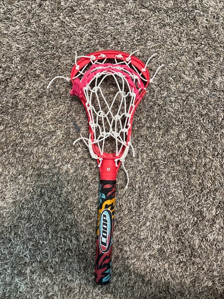 Pool lacrosse stick strung with sidewalk
